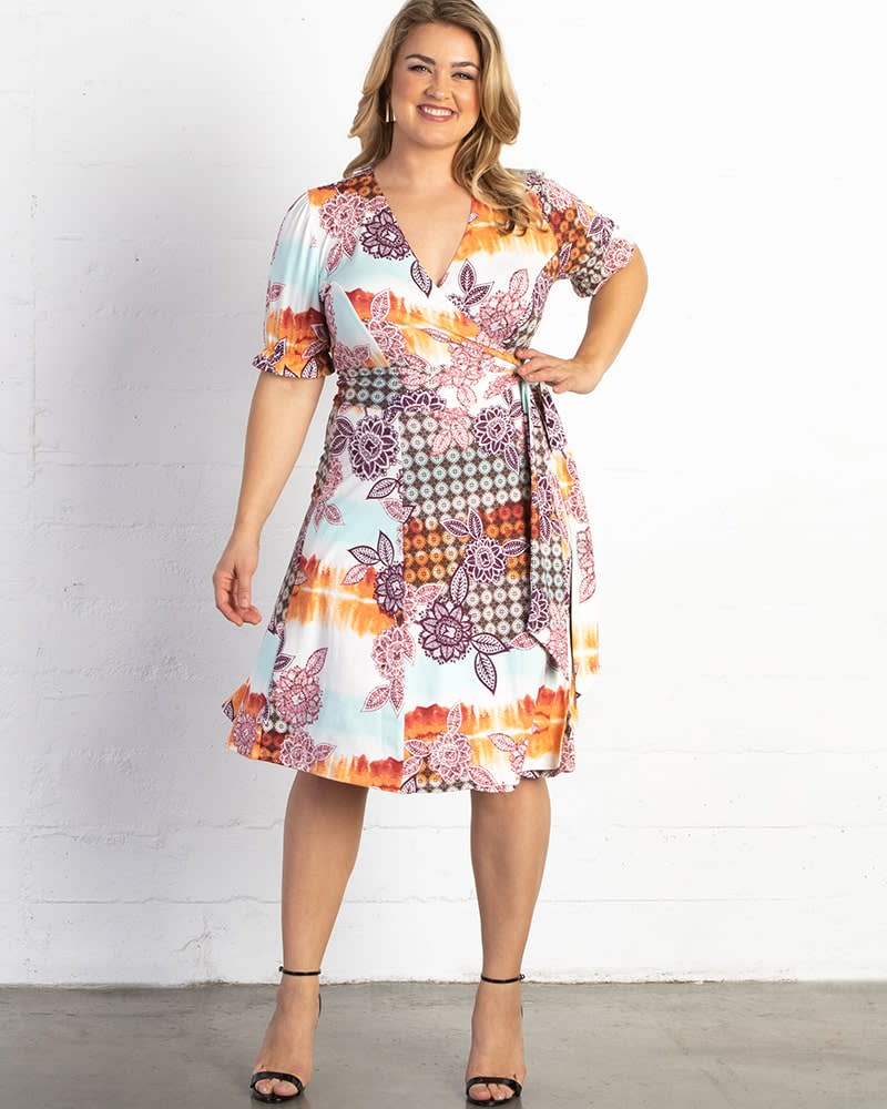 Front of a model wearing a size 0X Tuscan Tie-Wrap Dress in PRISMATIC SUNSET by Kiyonna. | dia_product_style_image_id:227453